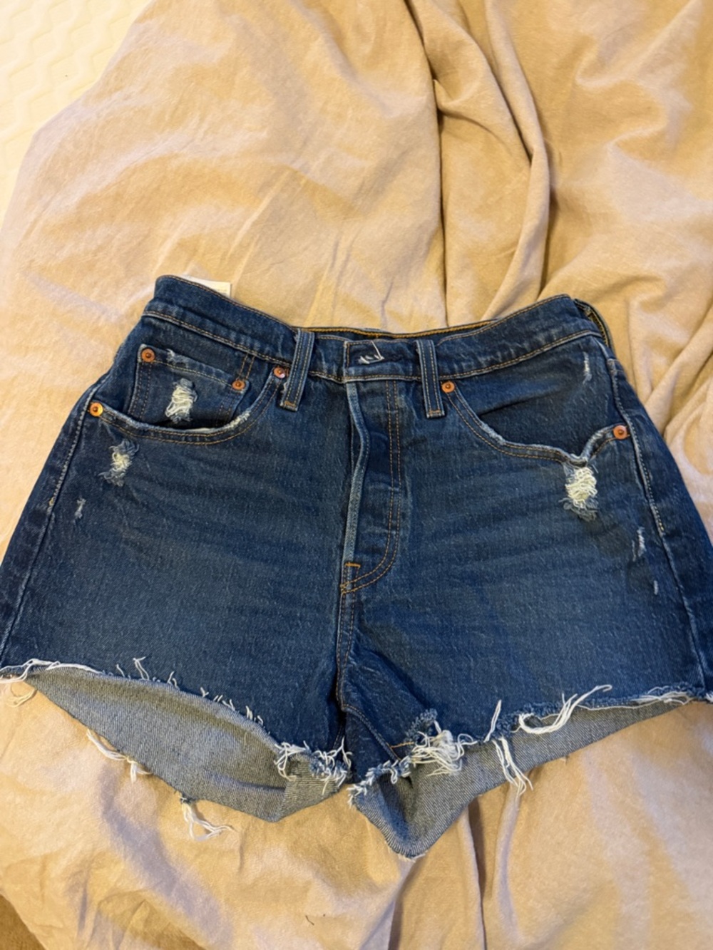 Levi’s High Rise Dark Blue Distressed Denim Shorts